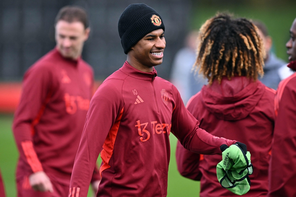 Manchester United's English striker #10 Marcus Rashford smiles as he attends a training session at the Carrington Training Complex in Manchester, north-west England on November 7, 2023 on the eve of their Uefa Champions League Group A football match away against FC Copenhagen. — AFP pic