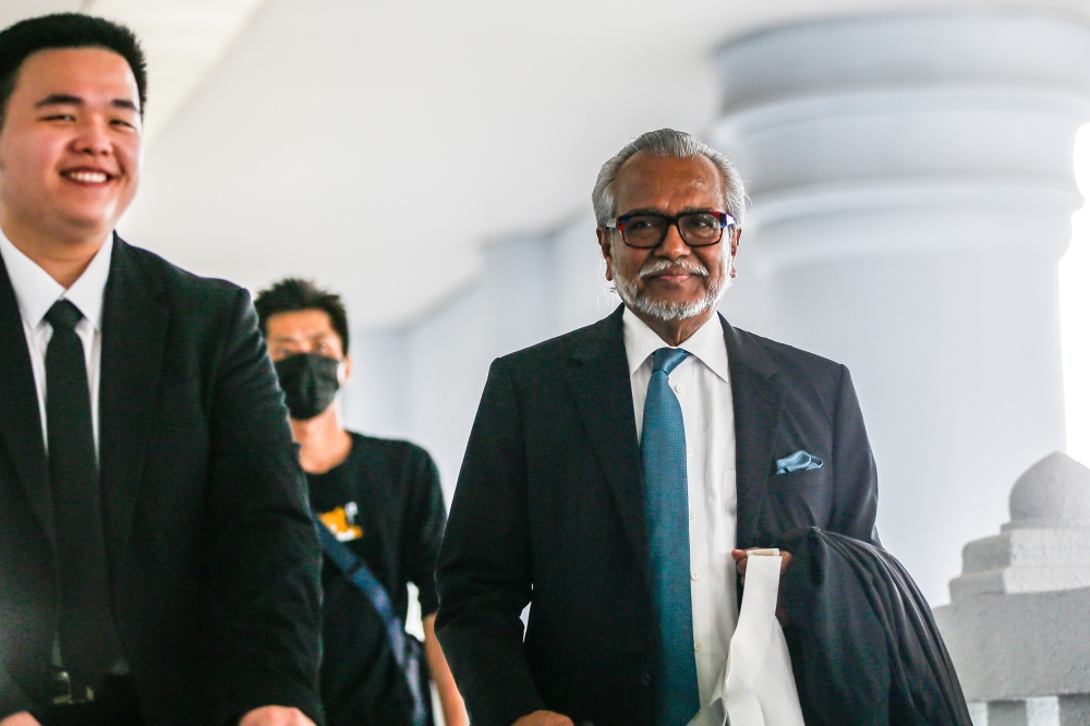 Tan Sri Muhammad Shafee Abdullah (right) is seen outside at the Kuala Lumpur Court Complex on November 8, 2023. — Picture by Hari Anggara.