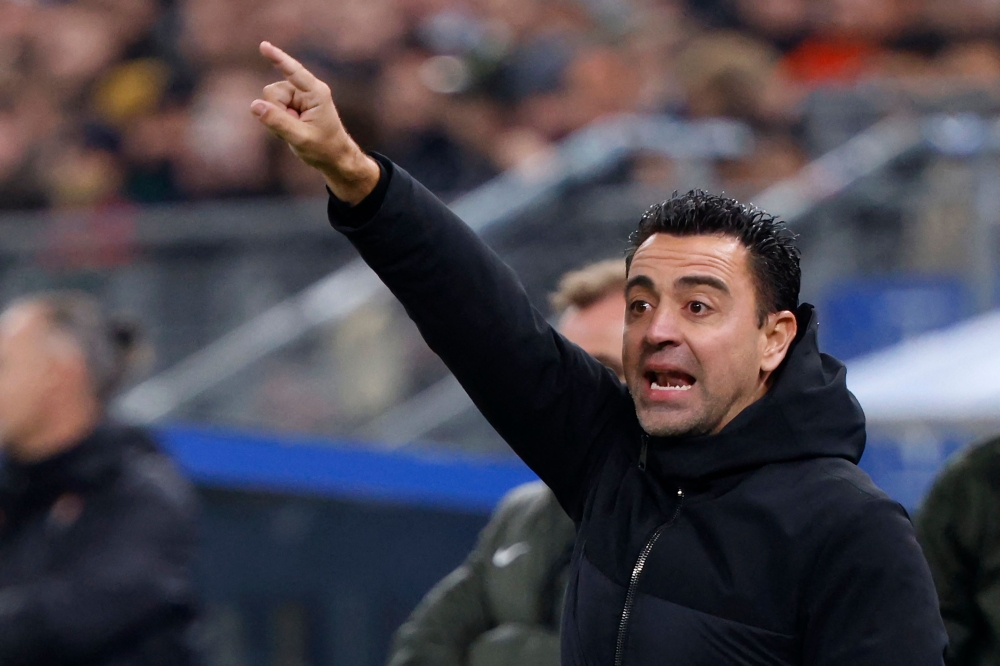 Barcelona's Spanish coach Xavi reacts during the UEFA Champions League Group H football match between FC Shakhtar Donetsk and FC Barcelona in Hamburg November 7, 2023. — AFP pic