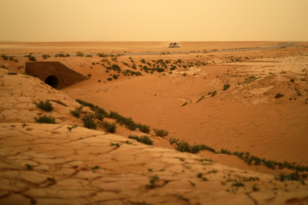 This picture shows arid land during a sandstorm in the countryside of the city of Tabqa in Syria's Raqqa governorate, on June 2, 2022. Syria is among the countries most vulnerable and poorly prepared for climate change, which is forecast to worsen, posing a further threat to the wheat harvests that are an essential income source for a war-battered population. — AFP pic