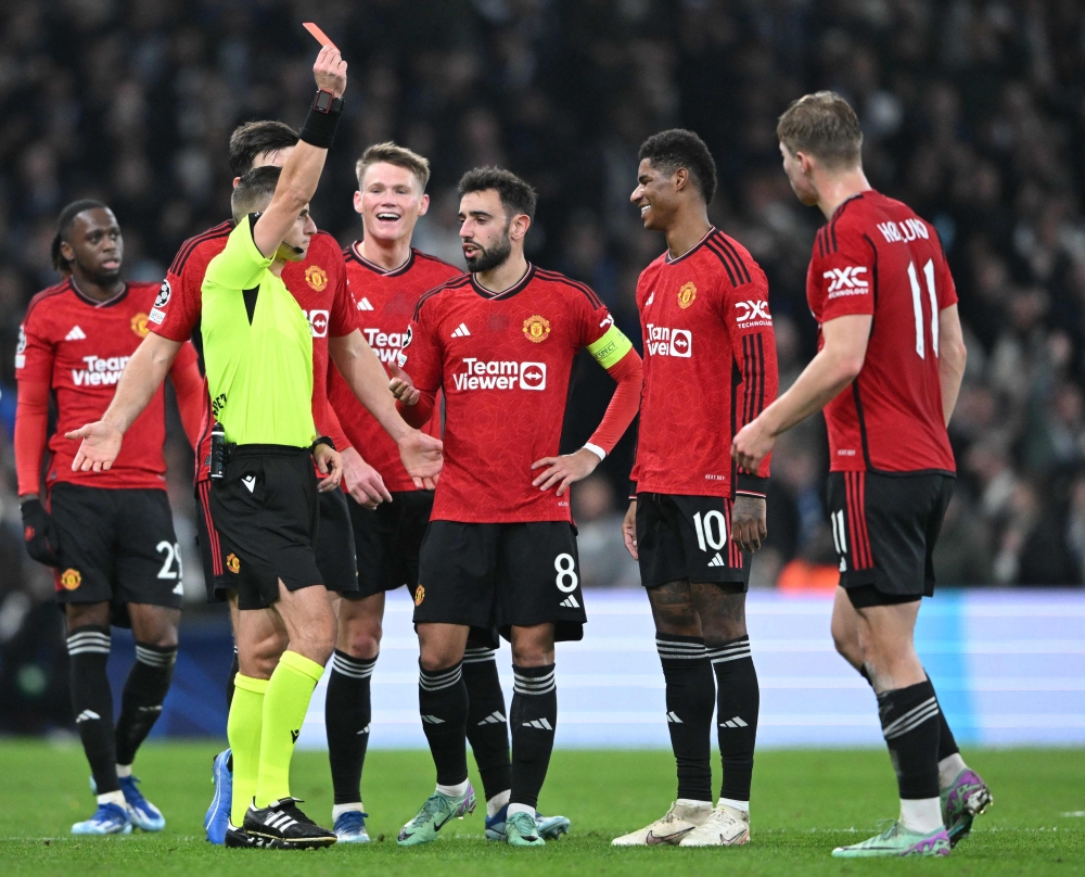 Lithuanian referee Donatas Rumsas shows the red card to Manchester United’s English striker Marcus Rashford during the Uefa Champions League Group A football match between FC Copenhagen and Manchester United FC in Copenhagen, Denmark on November 8, 2023. — AFP pic 