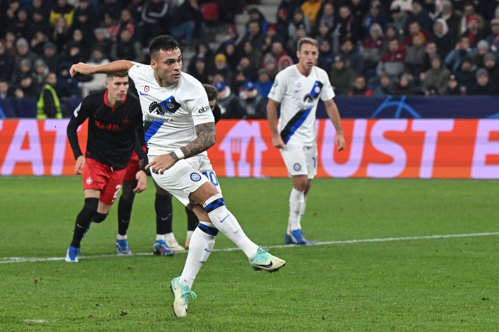 Inter Milan’s Argentine forward Lautaro Martinez scores the opening goal with his teammates during the Uefa Champions League Group D football match between FC Salzburg and Inter Milan in Salzburg, Austria on November 8, 2023. — AFP pic 