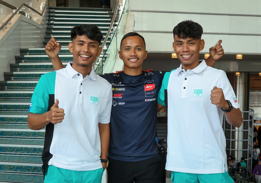 (From left) Malaysian MotoGP riders Azroy Hakeem Anuar, Syarifuddin Azman, also known as Damok, and Helmi Azman are seen after the meet and greet session at the Petronas Philharmonic Hall in Kuala Lumpur November 9, 2023. — Bernama pic