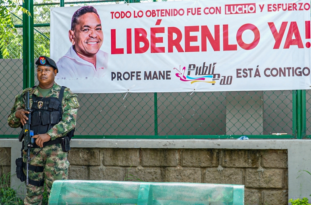 A Colombian Army member stands guard at a checkpoint in Barrancas, La Guajira, Colombia on November 7, 2023. The head of Colombia's ELN guerilla group commander Antonio Garcia had acknowledged the organisation made a ‘mistake’ when it abducted the father of Liverpool footballer Luis Diaz, and vowed to work toward his release. — AFP pic