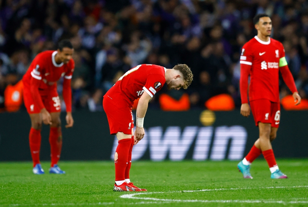 Liverpool's Harvey Elliott, Trent Alexander-Arnold and Joel Matip look dejected after conceding their second goal, scored by Toulouse's Thijs Dallinga. — Reuters pic