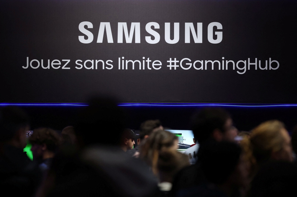 People walk by the Samsung logo at the Paris Games Week (PGW), a trade fair for video games in Paris, France, November 5, 2023. — Reuters pic