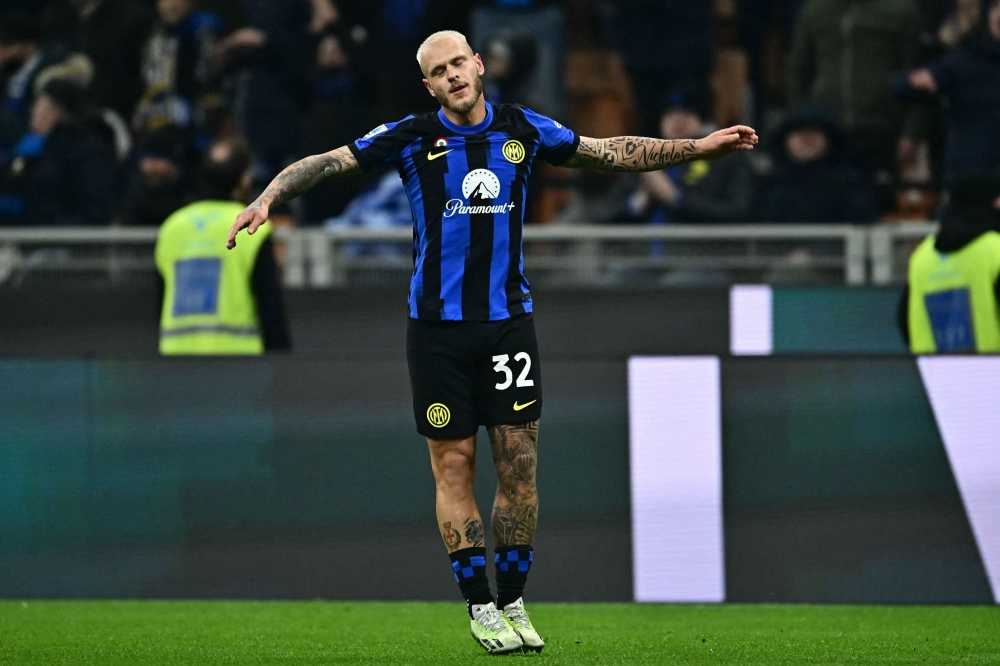 Inter Milan's Italian defender Federico Dimarco celebrates after scoring the team's first goal during the Italian Serie A football match between Inter Milan and Frosinone at San Siro Stadium, in Milan November 12, 2023. — AFP pic