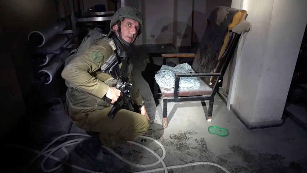 Israeli military spokesperson Rear Admiral Daniel Hagari points at a rope around the leg of a chair with women's clothing lying on the seat in the basement of Rantissi Hospital, a paediatric hospital with a specialty in treating cancer patients, at a location given as Gaza, in this still image taken from video released November 13, 2023. — Picture by Israel Defence Forces/Handout via Reuters