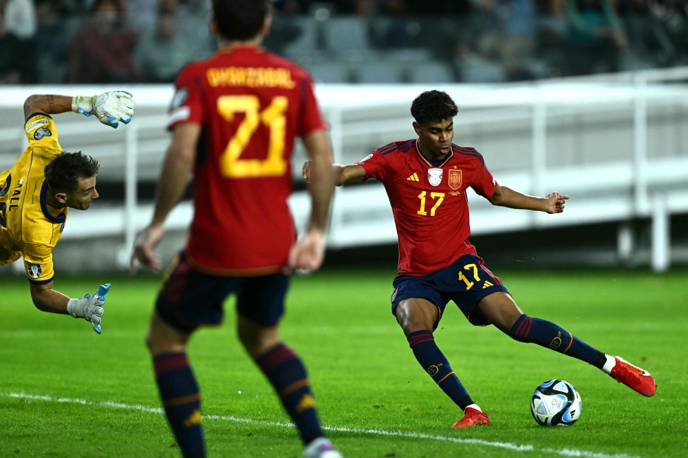 Spain's forward Lamine Yamal shoots to score his team's first goal during the Uefa Euro 2024 Group A qualifying football match between Cyprus and Spain at the Alphamega Stadium in Limassol November 16, 2023. — AFP pic