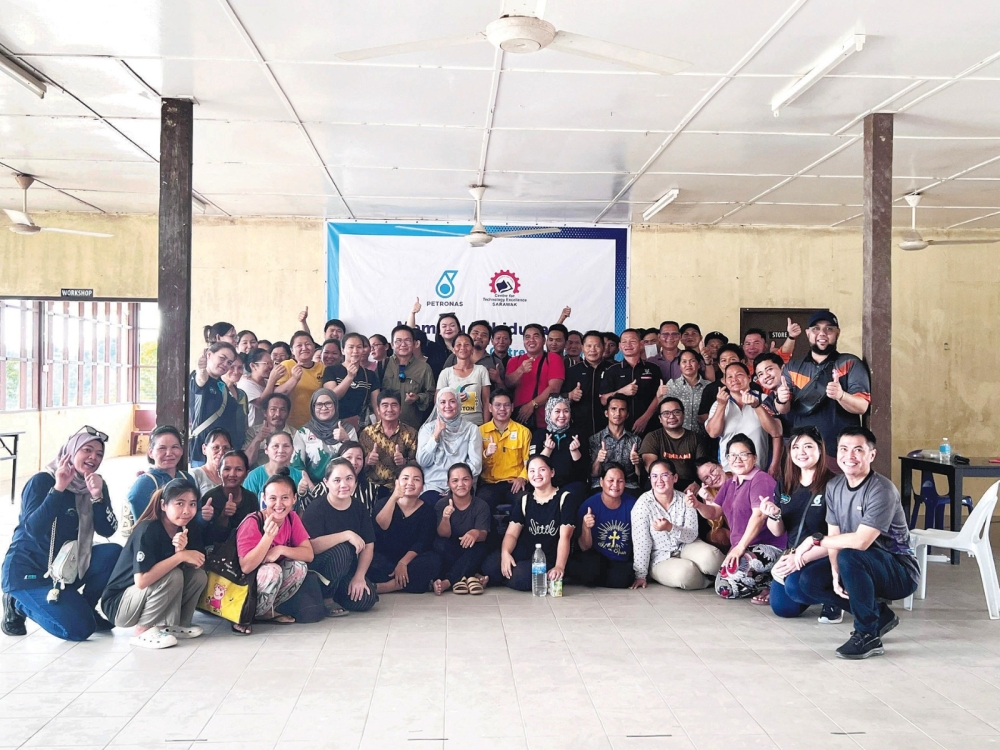 The organising committee with the CTOP short course participants at RSC Long Latei in Apoh Baram. ― Borneo Post pic