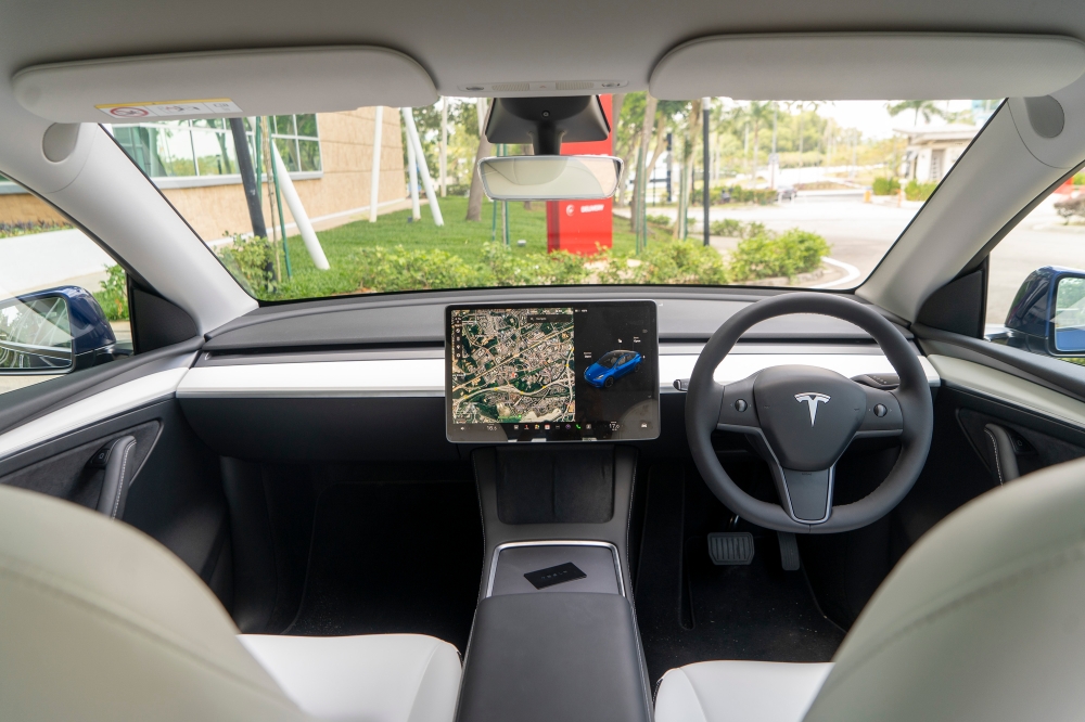 Tesla Model Y comes with a simplistic interior design that is mostly focused on a futuristic concept. — Picture by Shafwan Zaidon