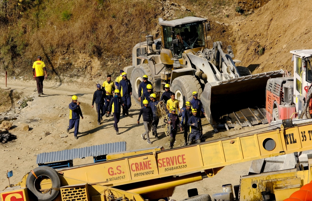 Rescue members from State Disaster Response Force (SDRF) arrive at the tunnel where workers are trapped after the tunnel collapsed in Uttarkashi, in the northern state of Uttarakhand, India, November 23, 2023. — Reuters pic