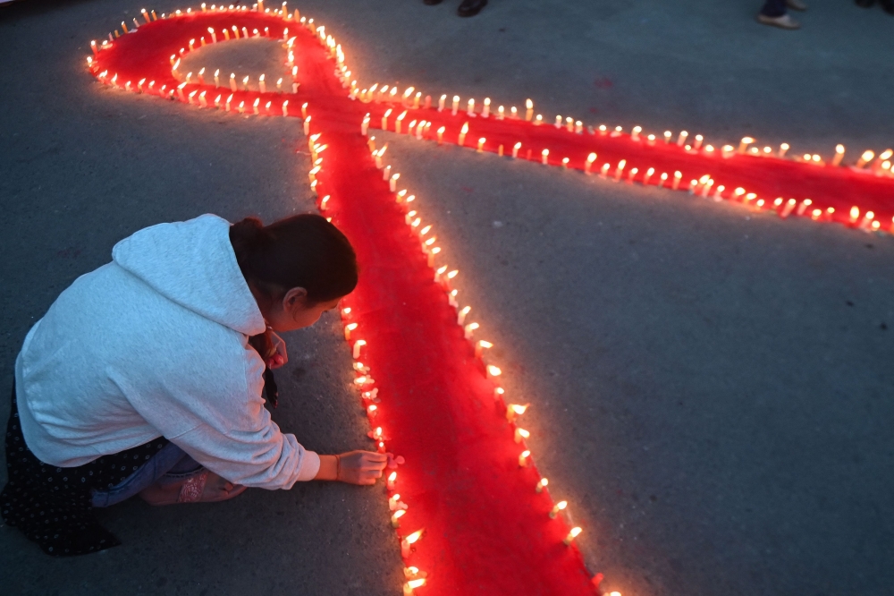 As we commemorate World AIDS Day, it is a time for us to remember friends and loved ones that we have lost to the disease and reflect on the immense progress made in the fight of HIV and on the work that still needs to be done to achieve an HIV free generation. — AFP pic