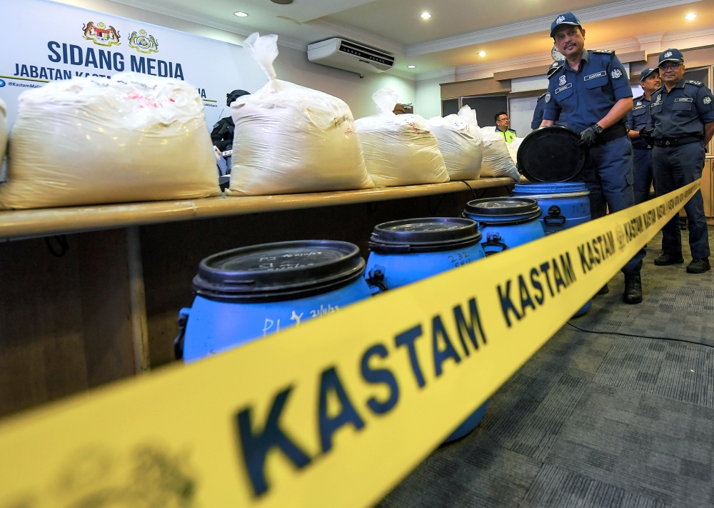 Customs Dept deputy director-general (Enforcement & Compliance) Datuk Sazali Mohamad with the seized drugs at the Narcotics Branch of the Royal Malaysian Customs Department Headquarters in Kampung Jijan, Nilai, December 1, 2023. — Bernama pic 