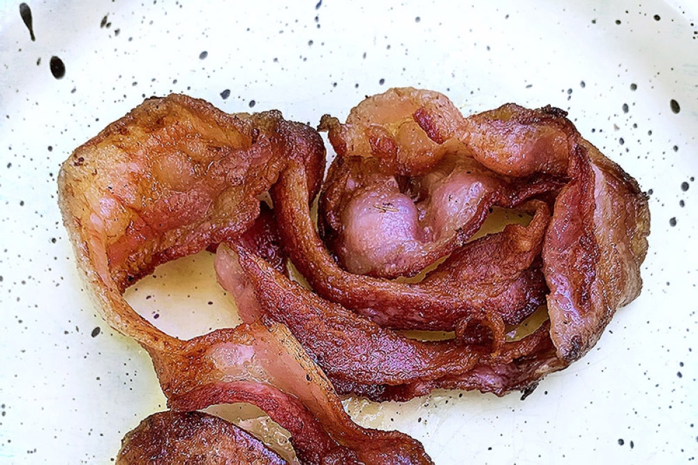 Bacon adds a flavourful, meaty component to the dish.