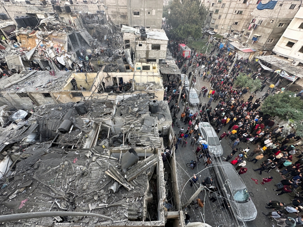 People search through the rubble of damaged buildings following an Israeli air strike on Palestinian houses, amid the ongoing conflict between Israel and the Palestinian Islamist group Hamas, in Rafah in the southern Gaza Strip December 12, 2023. — Reuters pic