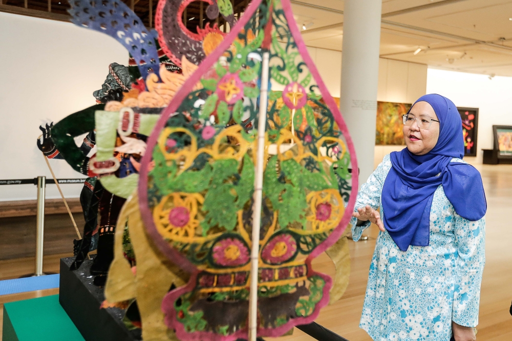 ‘Gerak Bayang’ curator Siti Melorinda Khuzaina Sakdudin spent two years collecting authentic wayang kulit art and pieces for the exhibition. — Picture by Sayuti Zainudin