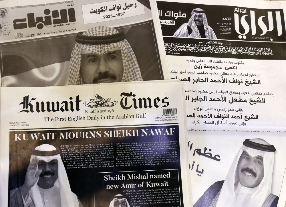 This picture taken on December 17, 2023 in Kuwait City shows a collection of Kuwaiti newspaper front pages, headlines featuring the death of Kuwait's Amir Sheikh Nawaf al-Ahmad Al-Sabah. — AFP pic