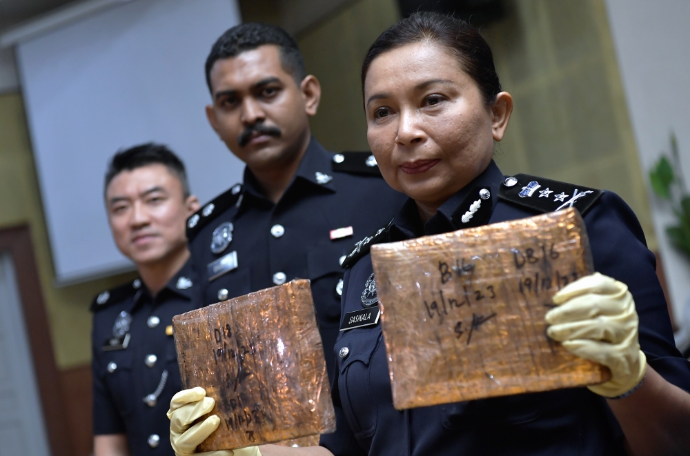 Selangor deputy police chief Datuk S. Sasikala Devi with seized ganja at a press conference at the Selangor contingent police headquarters in Shah Alam, December 20, 2023. On the fatal stabbing of a woman in Klang, she said based on initial investigations by the police, it was revealed that the 44-year-old suspect and the victim were lovers. — Bernama pic     