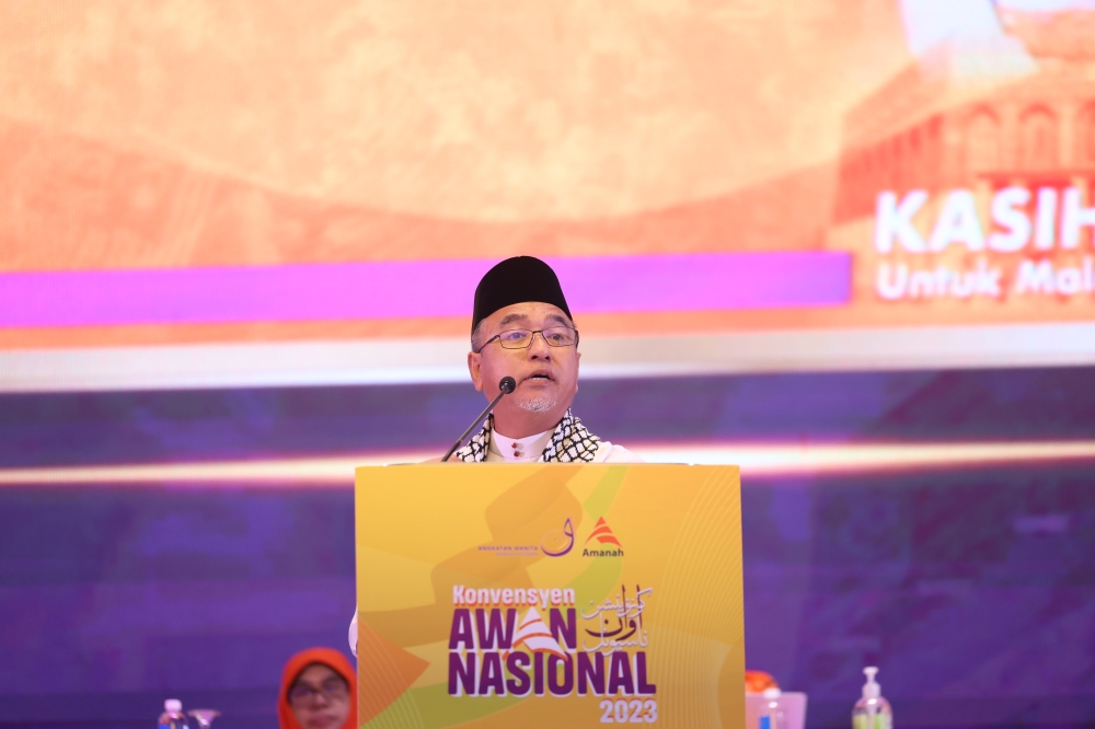 Amanah vice president Adly Zahari speaks at the inauguration of the 2023 National Awan Convention in Klang, December 22, 2023. — Bernama pic