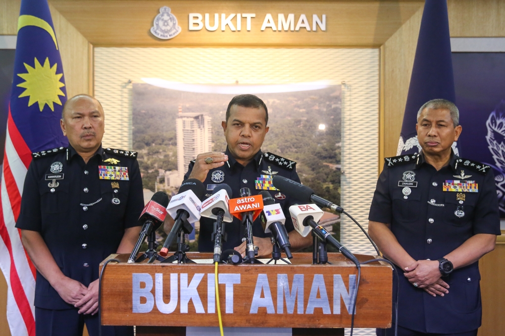 Deputy Inspector-General of Police Datuk Seri Ayob Khan Mydin Pitchay (centre) said 10 men aged between 30 and 48 were arrested in Sabah yesterday. — Picture by Yusof Mat Isa