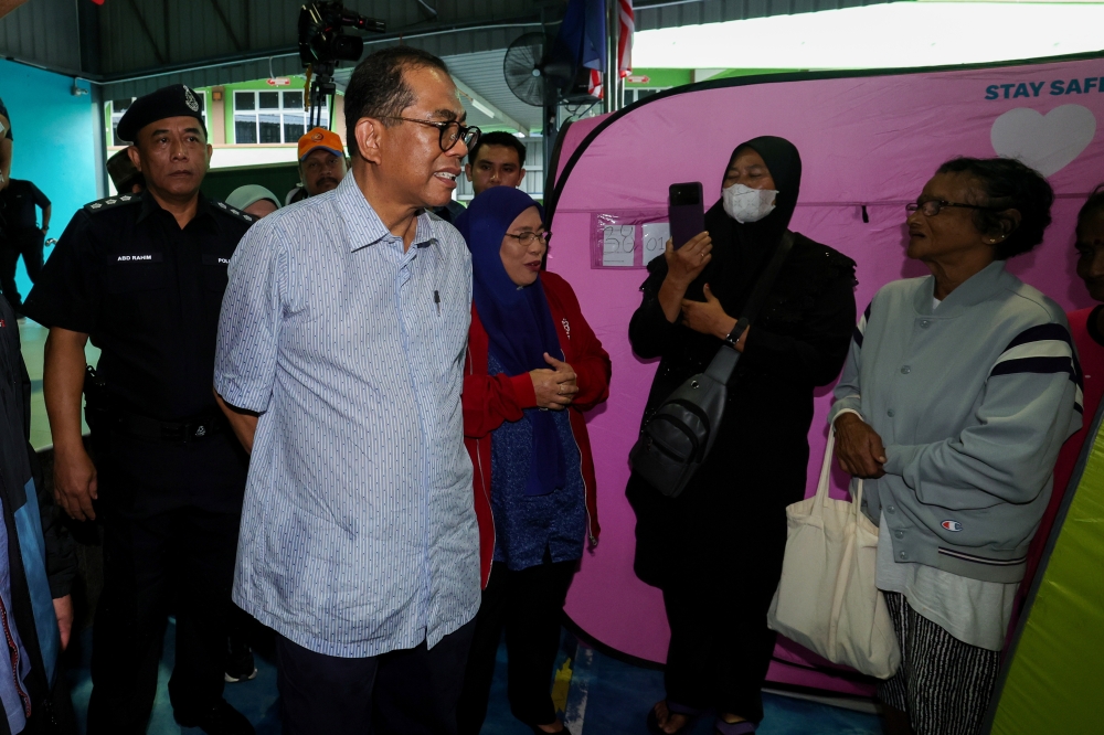 Defence Minister Datuk Seri Mohamed Khaled Nordin during a visit to a temporary flood relief centre at Sekolah Rendah Agama Bersepadu, in Kota Tinggi January 6, 2023. — Bernama pic