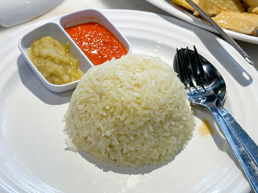 The rice has individual grains with a distinct texture and chicken aroma.