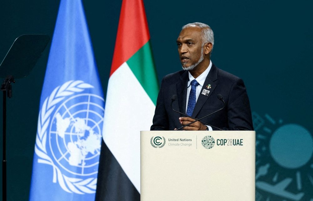 President of the Maldives Mohamed Muizzu delivers a national statement at the World Climate Action Summit during the United Nations Climate Change Conference (COP28) in Dubai December 1, 2023. — Reuters pic  