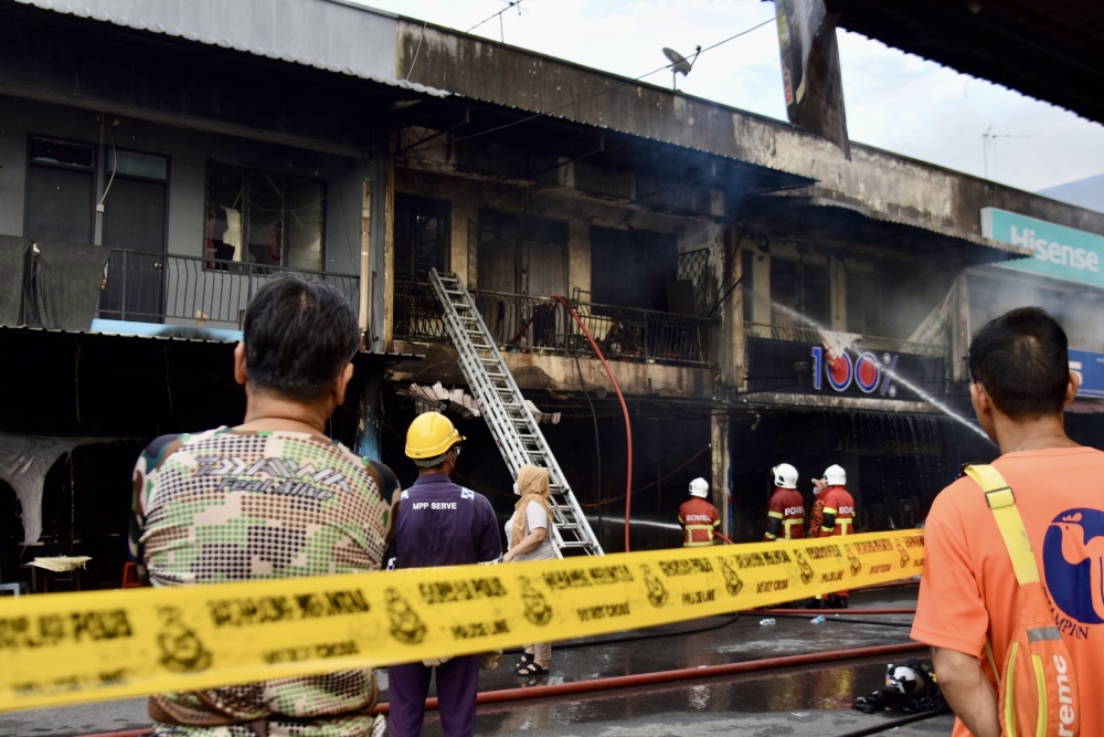 Four of the shop units were completely destroyed in the fire. — Borneo Post pic 