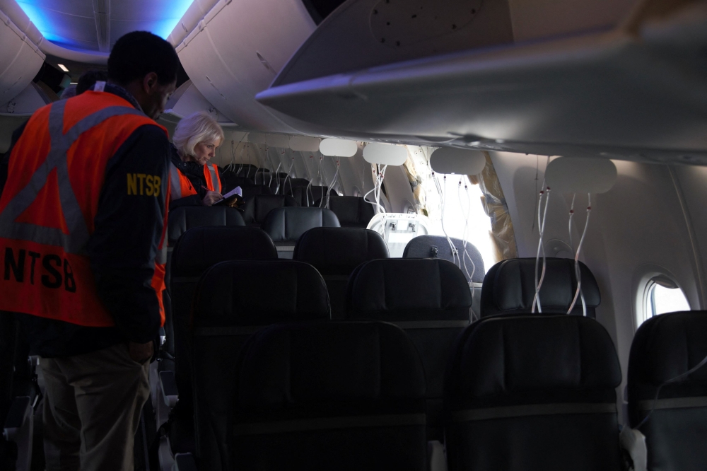 The fuselage plug area of Alaska Airlines Flight 1282 Boeing 737-9 MAX, which was forced to make an emergency landing with a gap in the fuselage, is seen during its investigation by the National Transportation Safety Board (NTSB) in Portland, Oregon January 7, 2024. — NTSB handout pic via Reuters