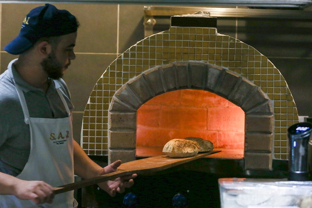 Lebanese breads studded with sesame and fennel seeds is cooked in the hot oven.