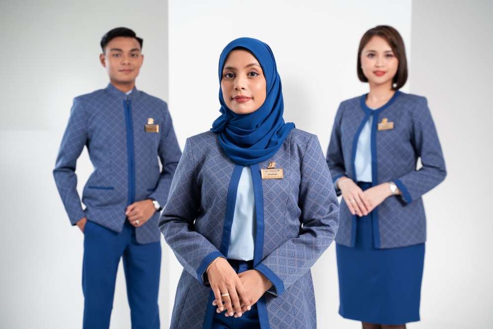 The uniform collection encompasses a tailored three-piece suit, with skirt or trouser options for women. — Picture courtesy of Malaysia Aviation Group 