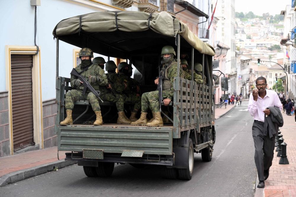 Ecuadorean security forces patrol the area around the main square and presidential palace after Ecuadorean President Daniel Noboa declared the country in a state of ‘internal armed conflict’ and ordered the army to carry out military operations against the country’s powerful drug gangs, in downtown Quito January 9, 2024. — AFP pic 