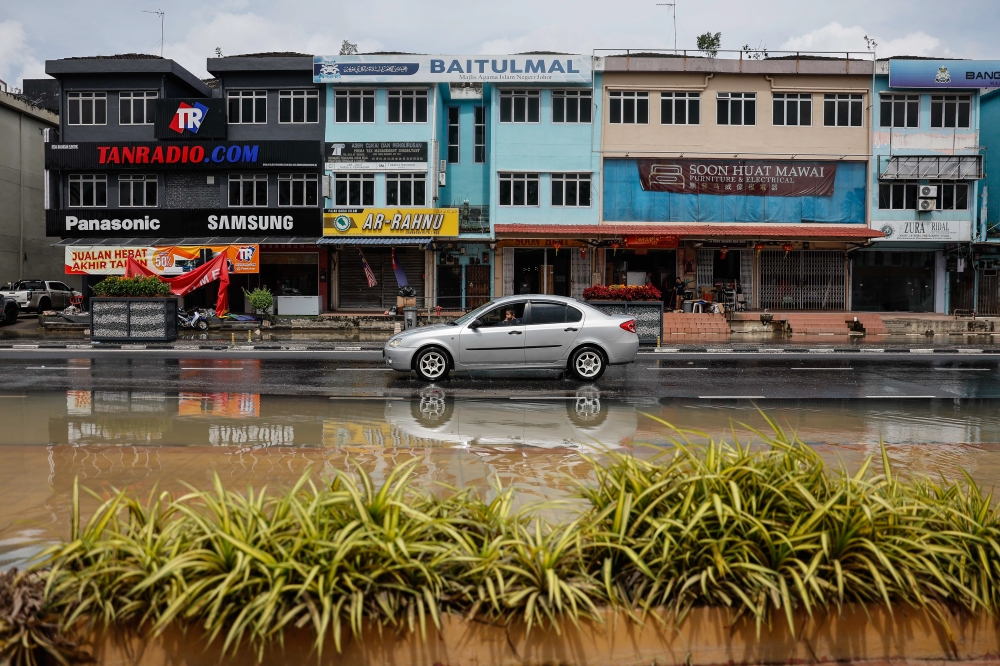 Checks by Bernama around the town centre found that the main roads, which were previously submerged up to two metres and closed until yesterday, can now be traversed by light vehicles, although the water has not completely receded. — Bernama pic 