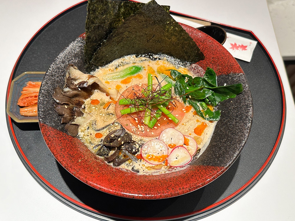 Everyone is curious about the unusual Miso & Gac Ramen, where rich miso is mixed in with the walnut mylk broth that also includes the super food Gac fruit.