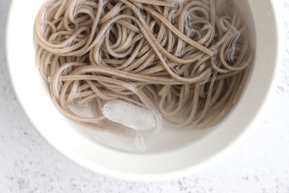 A quick soak in an ice bath prevents the soba from cooking further.