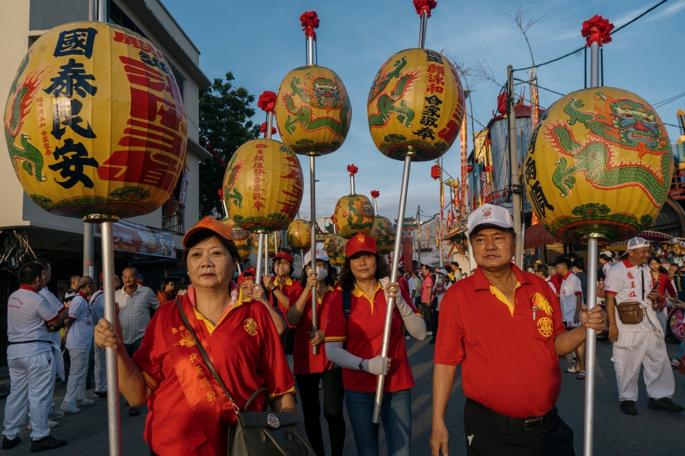 Devotees participate in the procession in Melaka. — Picture by Shafwan Zaidon