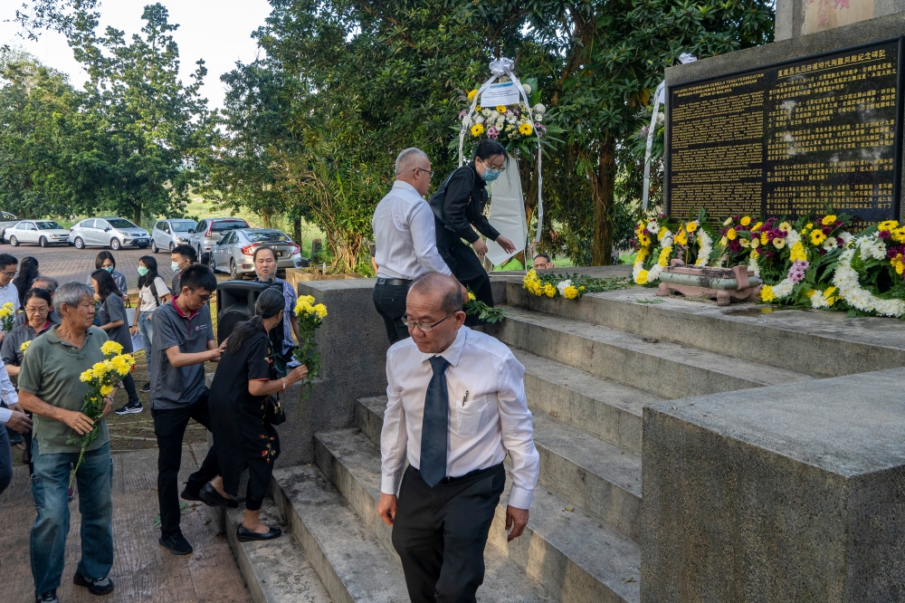 People pay their respects during the 1.11 KL Remembrance Sunday commemorating The Fall of KL at KL Hokkien Cemetery in Kuala Lumpur January 14, 2024. — Picture by Shafwan Zaidon