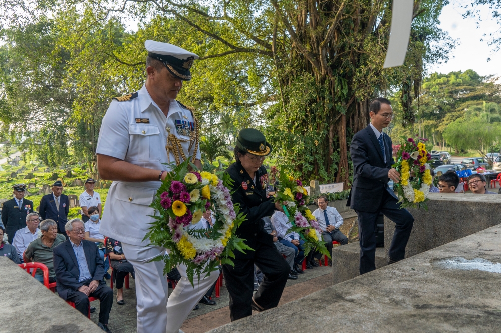 People pay their respects during the 1.11 KL Remembrance Sunday commemorating The Fall of KL at KL Hokkien Cemetery in Kuala Lumpur January 14, 2024. — Picture by Shafwan Zaidon