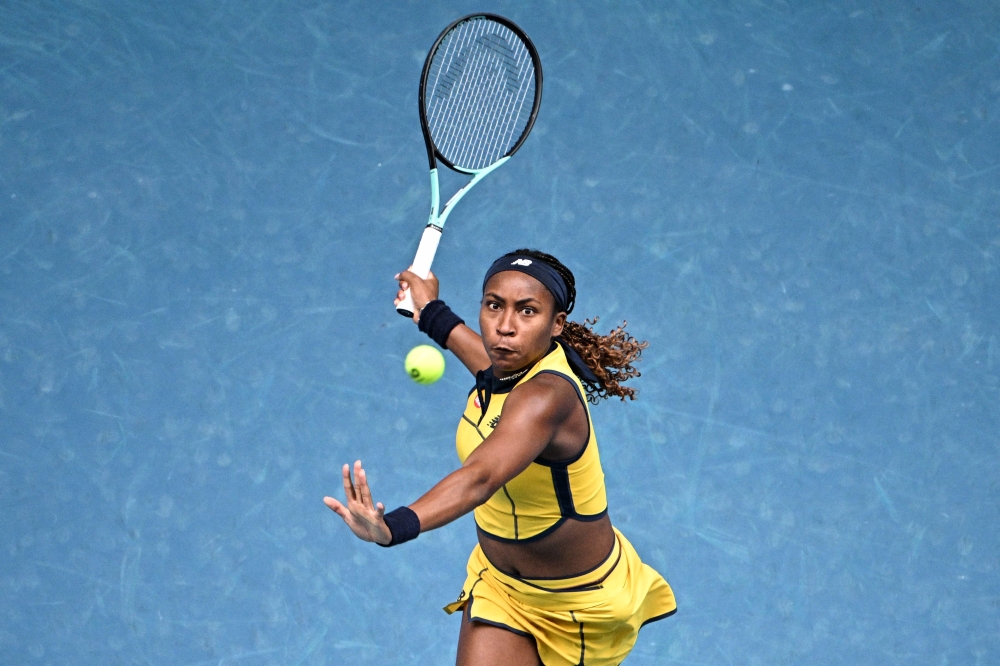 USA’s Coco Gauff hits a return against Poland’s Magdalena Frech during their women’s singles match on day eight of the Australian Open tennis tournament in Melbourne on January 21, 2024. — AFP pic 