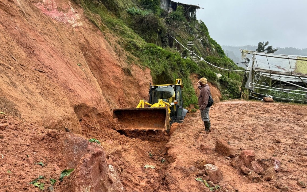 Public Works Department (JKR) personnel conducting clean-up work at the entrance of the landslide-hit area in Cameron Highlands, January 26, 2024. — Picture from Facebook/Jabatan Kerja Raya Malaysia (Public Works Department)