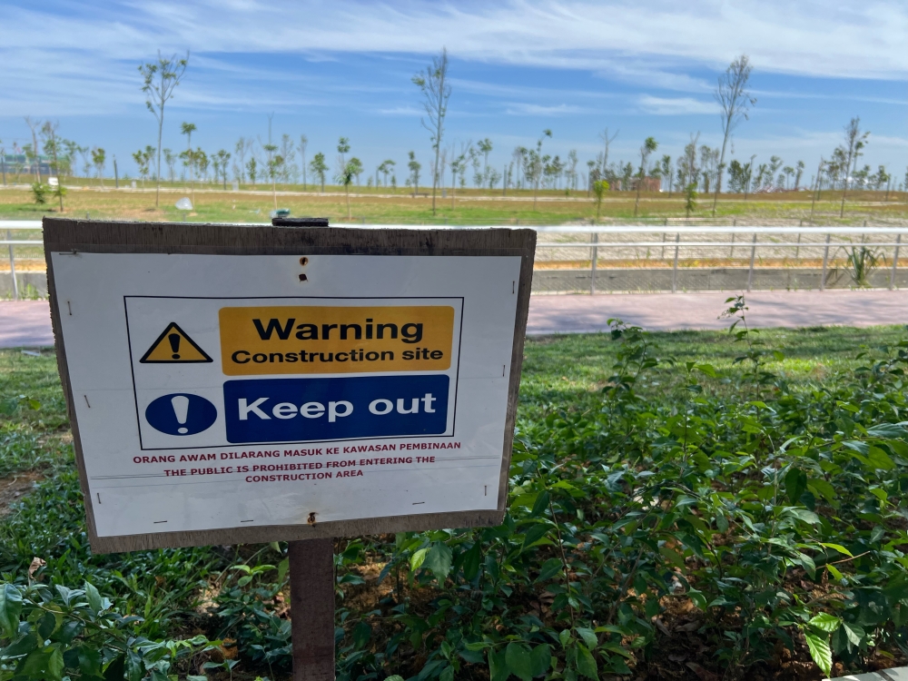 These signs are placed along the site to stop the public from entering — Picture by Opalyn Mok