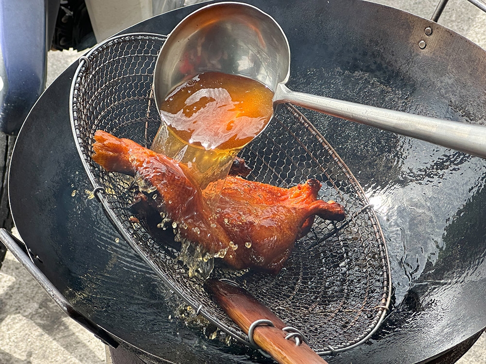 The 'pipa' duck is given a hot oil bath before serving.
