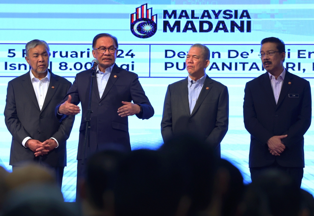 Prime Minister Datuk Seri Anwar Ibrahim (second from left) speaks during the monthly assembly at the Prime Minister's Department in Putrajaya February 5, 2024. — Bernama pic