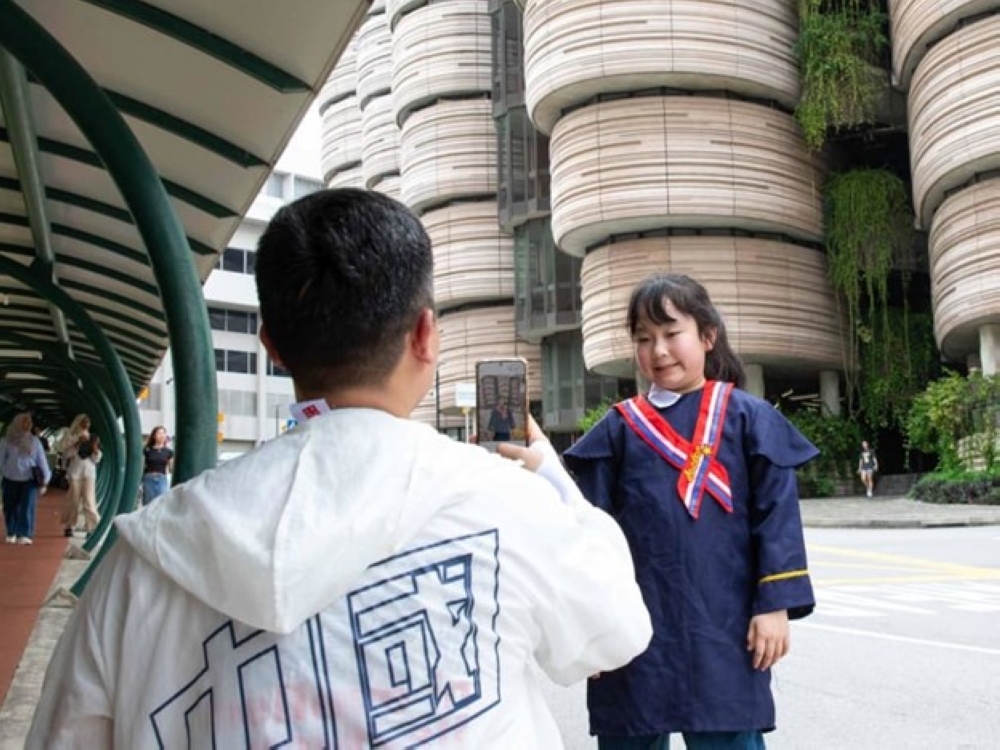 A tourist taking pictures at The Hive at Nanyang Technological University on Jan 31, 2024. — TODAY pic