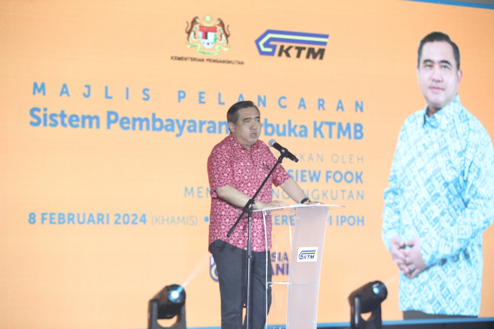 Transport Minister Anthony Loke speaks during the launch of KTMB's open payment system at the Ipoh Railway Station, February 8, 2024. — Picture by Farhan Najib