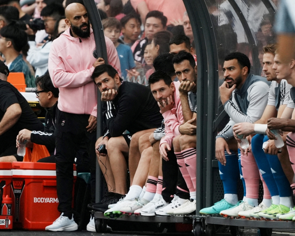 Inter Miami’s Lionel Messi, Sergio Busquets and teammates sit on the substitute bench during the match at Hong Kong Stadium, Hong Kong, February 4, 2024. — Reuters pic 