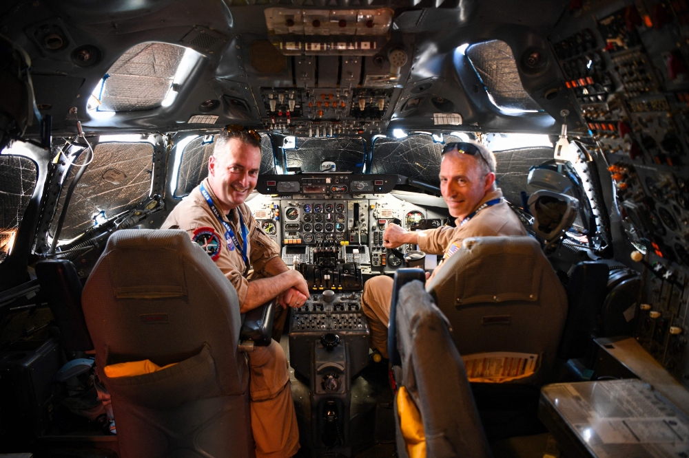 Andy Barry and Greg Slover, pilots of the National Aeronautics and Space Administration's (Nasa) DC-8 airborne science laboratory, pose for a photo inside the cockpit of the aircraft — AFP pic