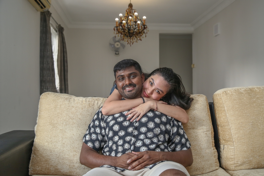 Tirkartikeyan Kumaresan and his fiancé Nguyen Thi Hoang Yen pose for a picture during an interview with Malay Mail at their house in Kuala Lumpur February 9, 2024. — Picture by Yusof Mat Isa