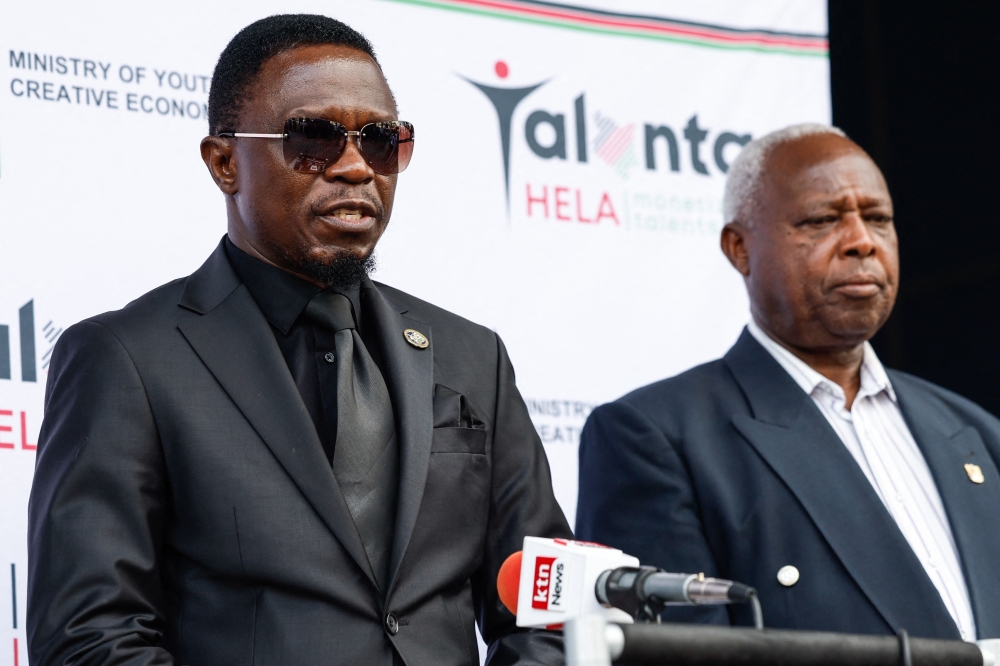 Kenya cabinet secretary for Youth Affairs, Sports and the Arts, Ababu Namwamba (left), flanked by athletics Kenya President Jackson Tuwei, briefs the press following the death of world marathon record-holder Kelvin Kiptum, at his office in Nairobi on February 12, 2024. — AFP pic